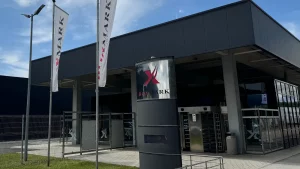 a building with a flag and a sign